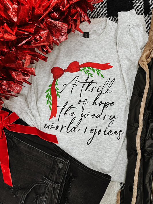 A THRILL OF HOPE THE WEARY WORLD REJOICES